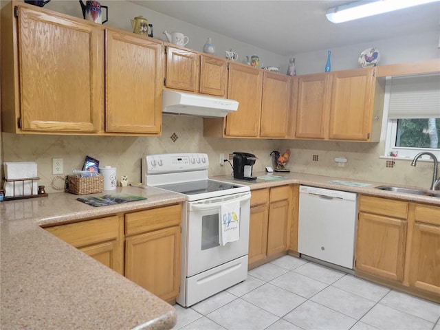 kitchen with light tile patterned floors, white appliances, backsplash, and sink