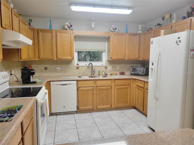 kitchen featuring backsplash, sink, light tile patterned flooring, and white appliances