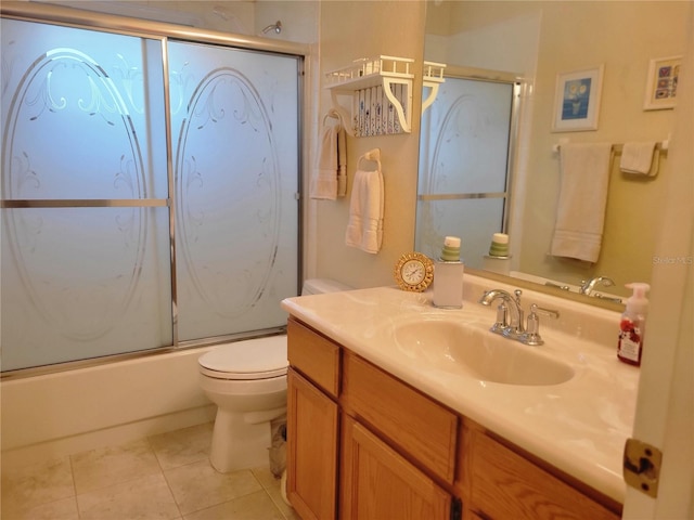 full bathroom featuring tile patterned floors, vanity, bath / shower combo with glass door, and toilet