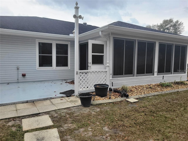 exterior space with a lawn and a patio area