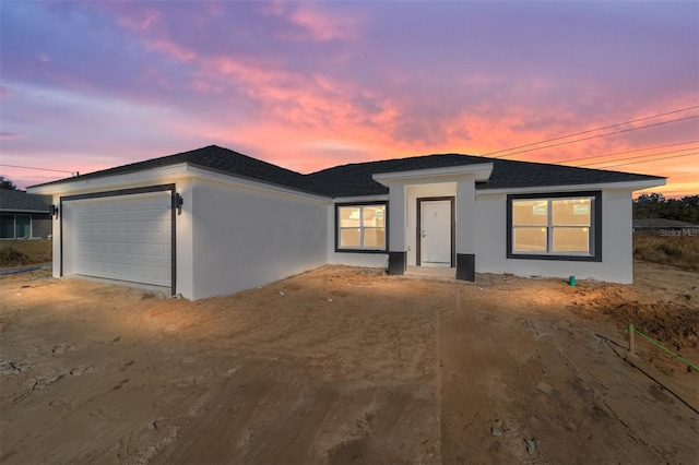 view of front of property with a garage