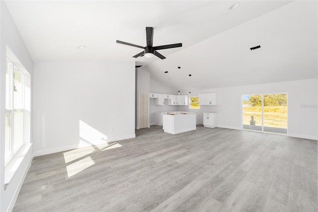 unfurnished living room with ceiling fan, light hardwood / wood-style flooring, and lofted ceiling