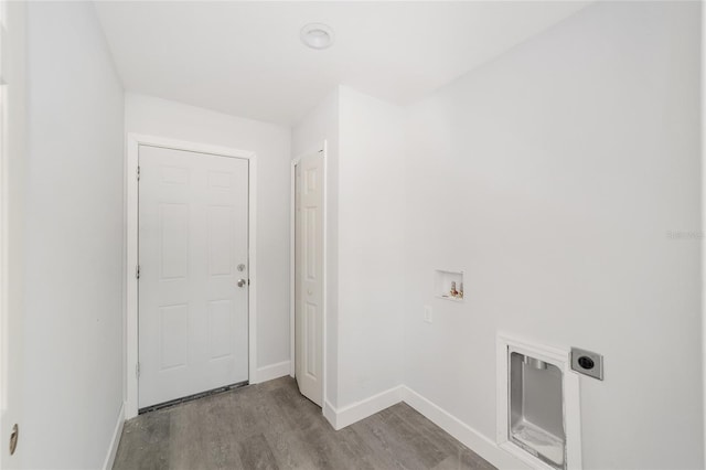 laundry room featuring light hardwood / wood-style flooring, hookup for a washing machine, and electric dryer hookup