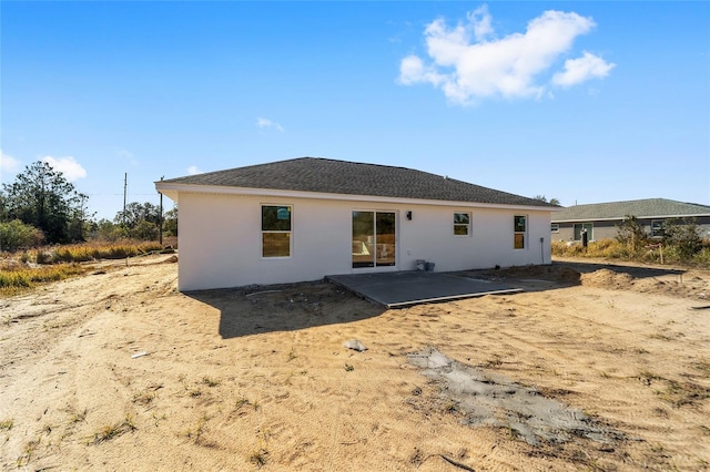 back of property with a patio area