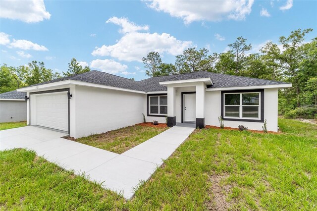 55 Locust Loop Cir, Ocala, FL 34472 - view of front facade with an attached garage, stucco siding, and a front lawn