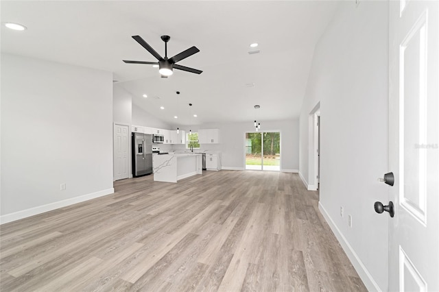 55 Locust Loop Cir, Ocala, FL 34472 - unfurnished living room with ceiling fan, recessed lighting, light wood-type flooring, and high vaulted ceiling