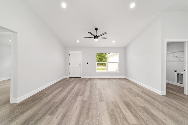 55 Locust Loop Cir, Ocala, FL 34472 - unfurnished living room with ceiling fan, light wood-style floors, recessed lighting, and lofted ceiling