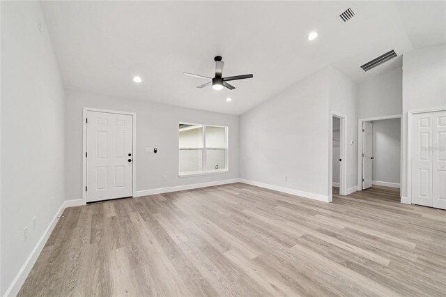 55 Locust Loop Cir, Ocala, FL 34472 - unfurnished living room featuring ceiling fan, lofted ceiling, light wood finished floors, and recessed lighting