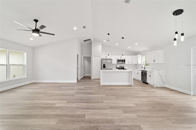 55 Locust Loop Cir, Ocala, FL 34472 - unfurnished living room featuring a ceiling fan, vaulted ceiling, recessed lighting, and light wood finished floors