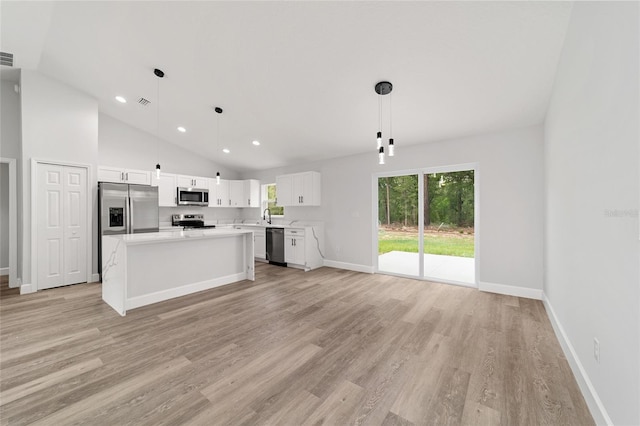 55 Locust Loop Cir, Ocala, FL 34472 - unfurnished living room with light wood finished floors, recessed lighting, and high vaulted ceiling