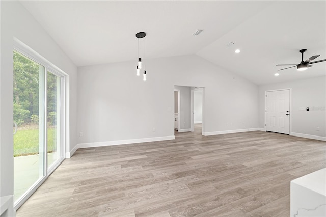 55 Locust Loop Cir, Ocala, FL 34472 - unfurnished living room with vaulted ceiling, ceiling fan, light wood-style floors, and recessed lighting