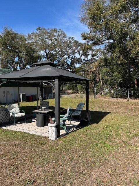 view of home's community with a gazebo, a lawn, and a patio