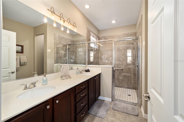 bathroom with vanity, tile patterned floors, and an enclosed shower