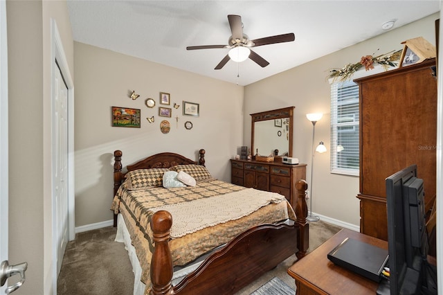 carpeted bedroom featuring ceiling fan and a closet