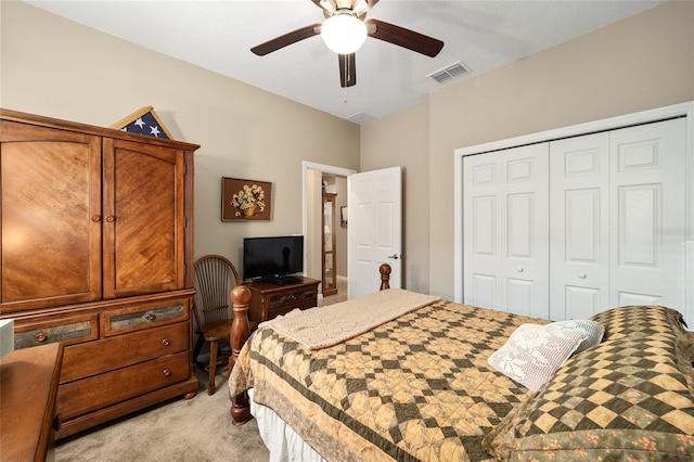 bedroom featuring ceiling fan, light colored carpet, and a closet