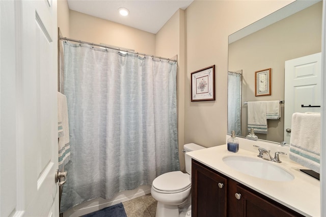 full bathroom featuring toilet, shower / bath combo, vanity, and tile patterned floors