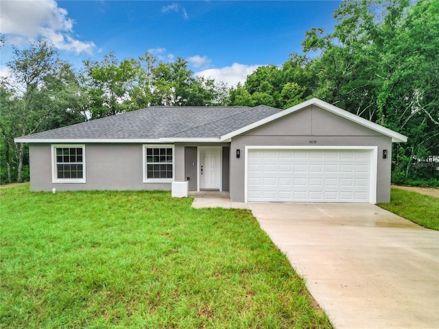 single story home featuring a front yard and a garage