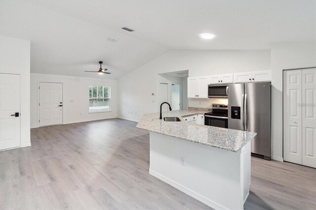 kitchen featuring light stone countertops, ceiling fan, sink, stainless steel appliances, and white cabinets