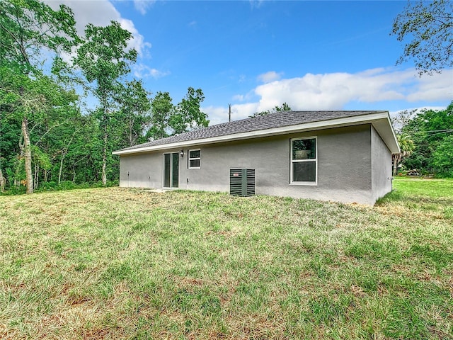 rear view of house with a lawn