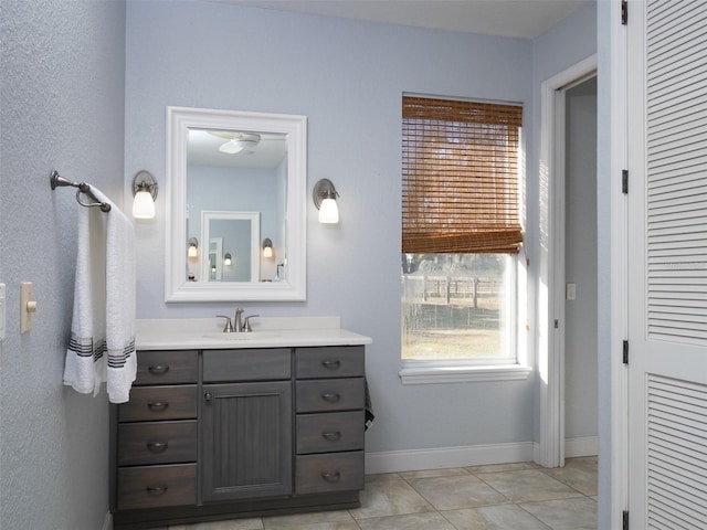 bathroom with tile patterned floors and vanity