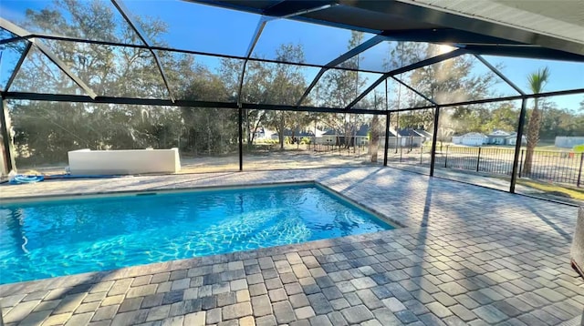 view of pool featuring a patio area and a lanai