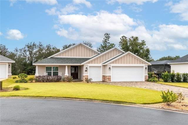 craftsman house with a garage and a front lawn