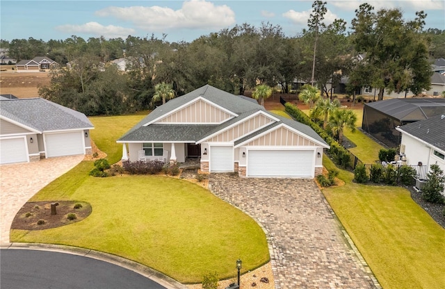 view of front of home with a garage and a front yard