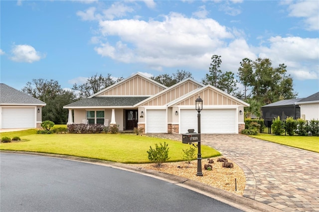 craftsman-style home featuring a garage and a front yard