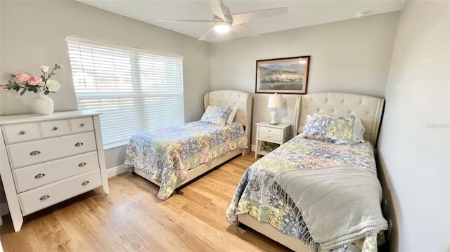 bedroom with ceiling fan and light hardwood / wood-style flooring