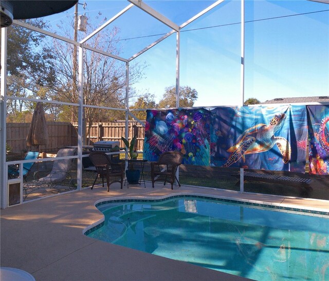 view of pool featuring a lanai and a patio area