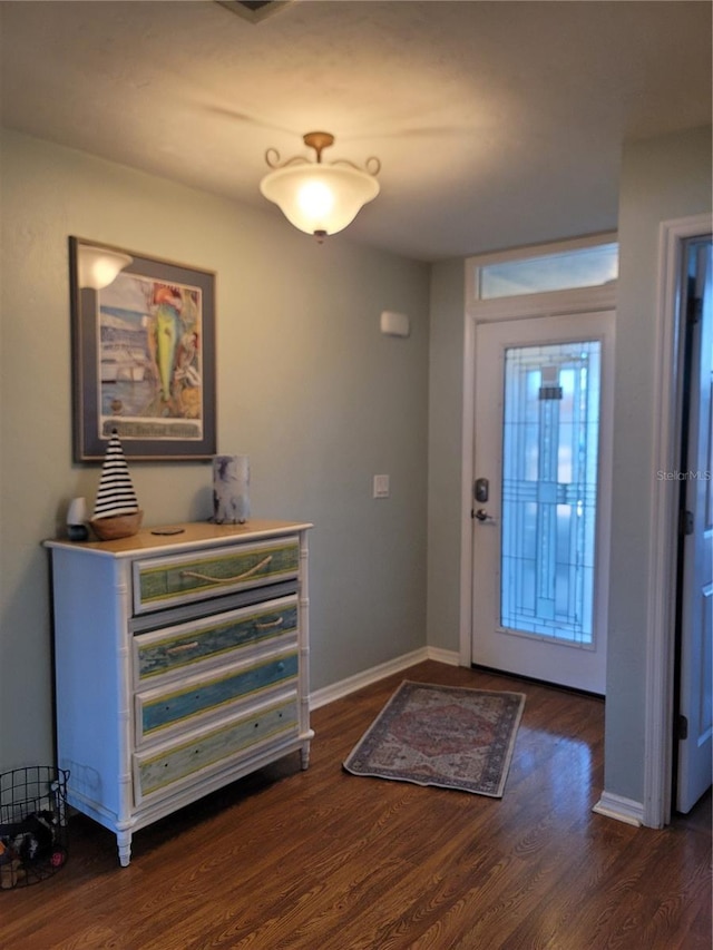 foyer entrance with dark hardwood / wood-style flooring