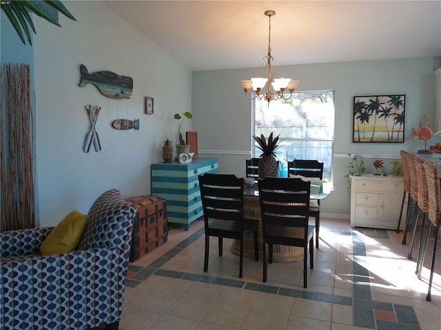 dining room featuring light tile patterned floors and a notable chandelier