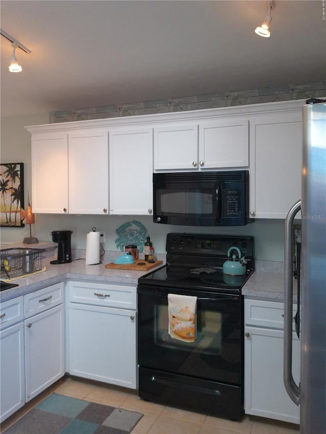 kitchen featuring black appliances, white cabinets, light tile patterned floors, and rail lighting