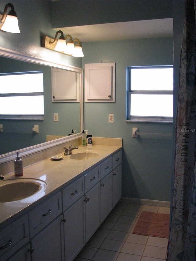 bathroom with tile patterned flooring and vanity