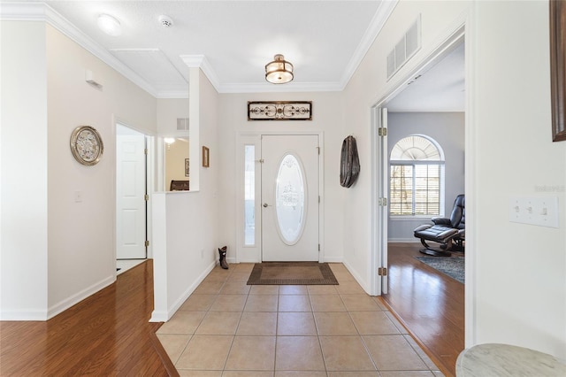 tiled entryway with crown molding