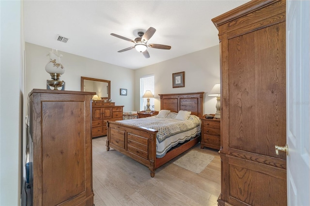 bedroom with light hardwood / wood-style flooring and ceiling fan