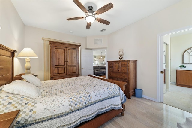 bedroom with ceiling fan and light wood-type flooring