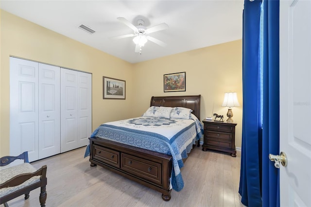 bedroom featuring ceiling fan, a closet, and light hardwood / wood-style flooring