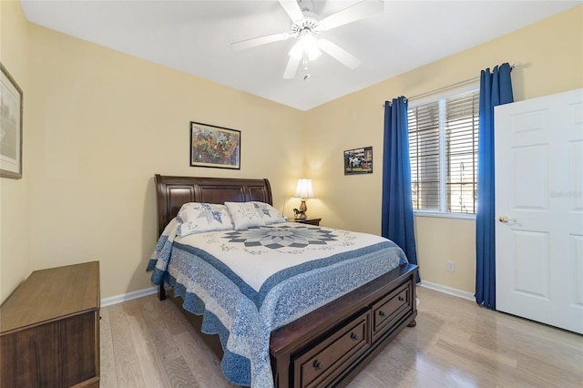 bedroom with light hardwood / wood-style flooring and ceiling fan