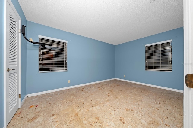 unfurnished bedroom featuring a textured ceiling