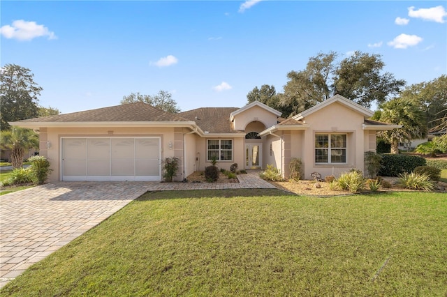 ranch-style house with a front yard and a garage