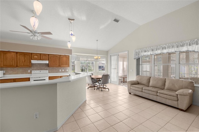 kitchen featuring lofted ceiling, ceiling fan with notable chandelier, light tile patterned floors, decorative light fixtures, and white range oven