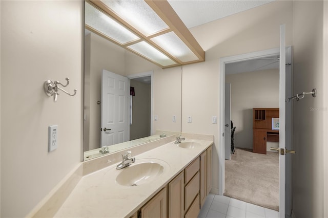 bathroom featuring tile patterned floors and vanity