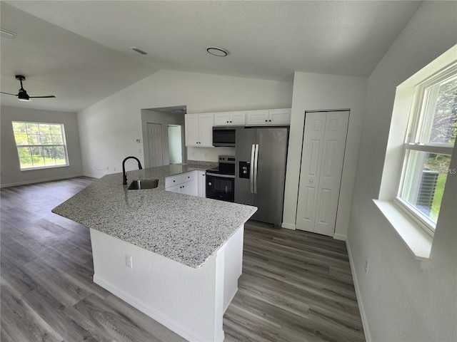 kitchen with sink, stainless steel appliances, white cabinetry, and a wealth of natural light