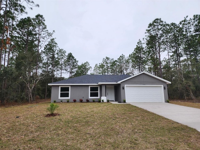 single story home with a garage and a front lawn