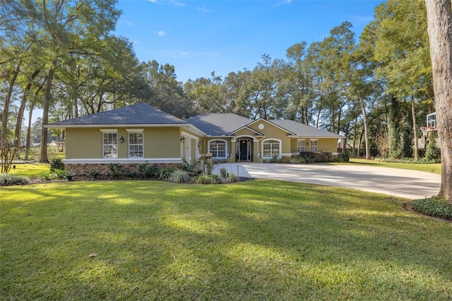 ranch-style home featuring a front yard