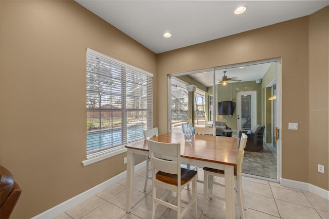 tiled dining area featuring ceiling fan