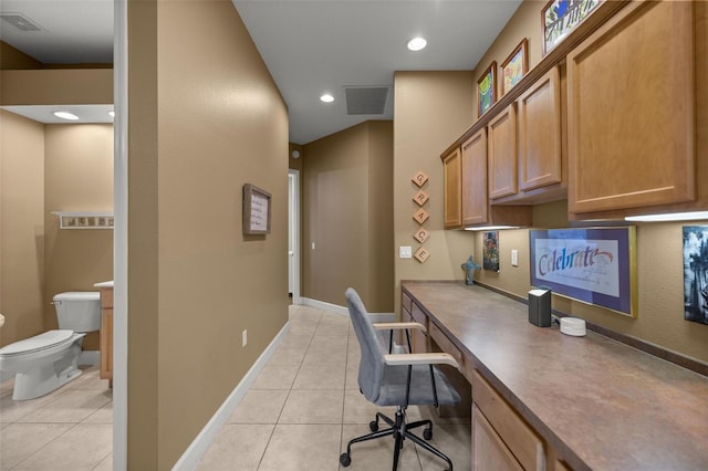 tiled home office featuring built in desk