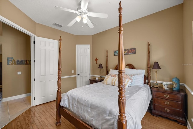 bedroom featuring ceiling fan and light hardwood / wood-style flooring