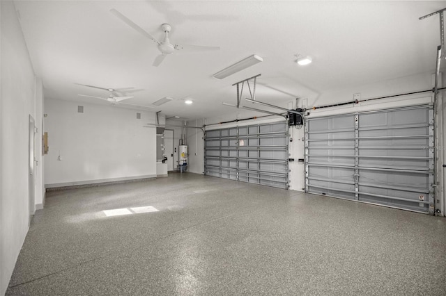 garage featuring ceiling fan and water heater